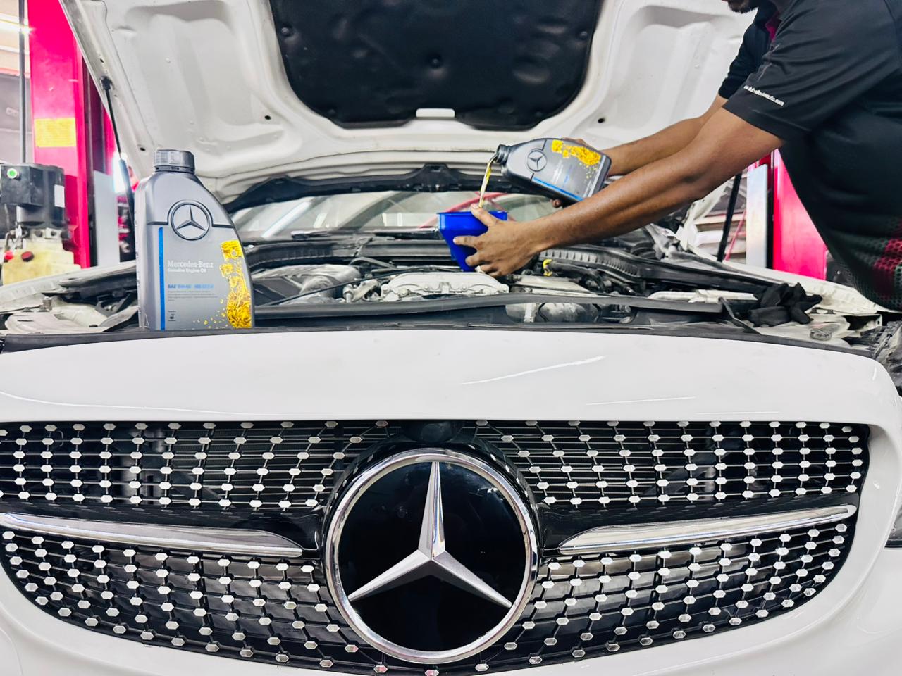 Mechanic performing suspension maintenance