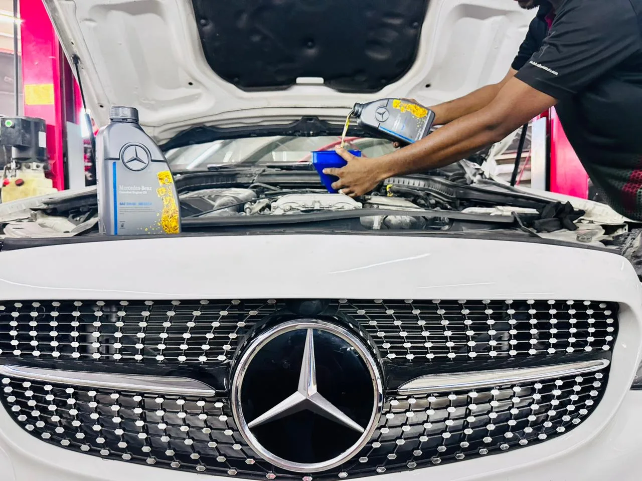 Mechanic performing suspension maintenance